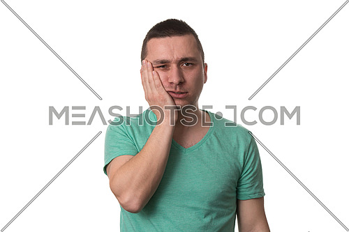 Portrait Of Young Man With Sensitive Tooth Ache Crown Problem , Suffering From Pain, Touching Outside Mouth With Hand, Isolated On White Background
