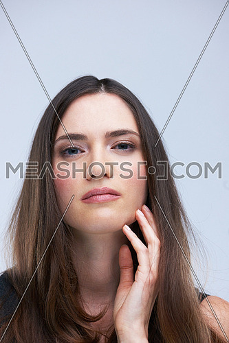 portrait of young woman isolated on white background  in studio