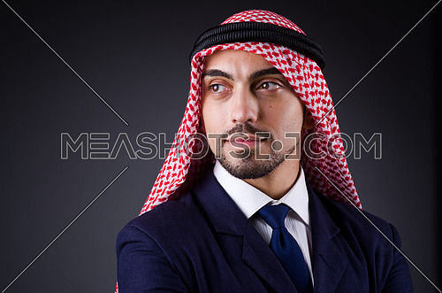 Arab businessman in dark studio