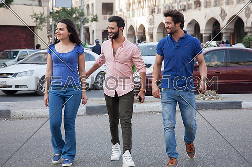 A group of friends crossing the street in Cairo Egypt