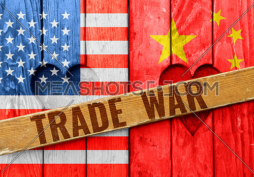 Close up closed wooden window shutters with heart shapes, American and Chinese flags painted as symbol of trade war
