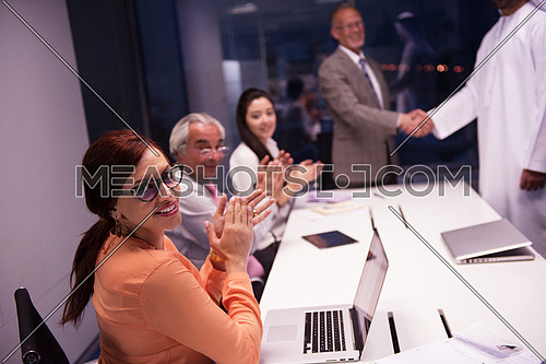 business people make agreement and  handshake on  meeting at modern office ate late night