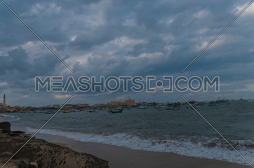 Long Shot for sea shore showing fishing boats and street at alexandria at day