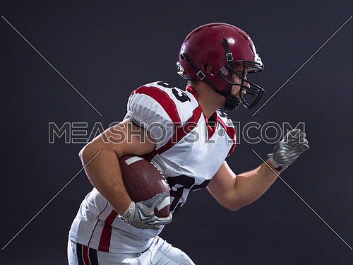 American football Player running with the ball isolated on a gray background