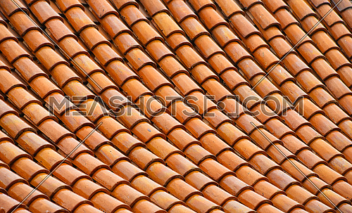 Asian brown and orange glazed ceramic roof scale tiles texture