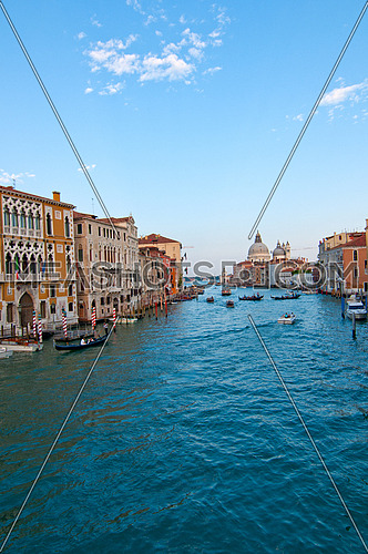 Venice Italy grand canal view from the top of Accademia bridge with "Madonna della Salute" church on background