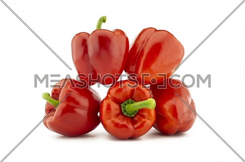 A stack of red bell peppers isolated on white background