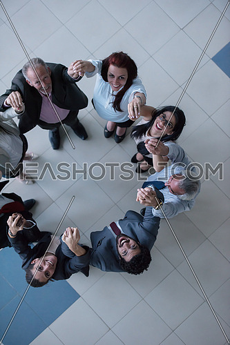 top view of multi ethnic  business people group as team  standing in circle and joining hands