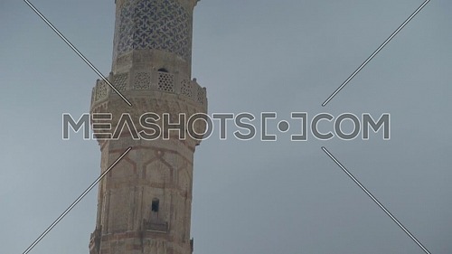 Tilt up Shot for Al-Azhar Mosque's Minaret in Cairo by day