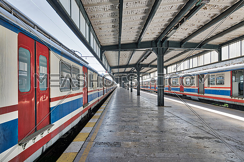 Interior shot of Haydarpasha Railway Terminal featuring metal truss and two colored stopped trains, Kadikoy, Istanbul, Turkey, built 1909 and closed in 2013 due to the rehabilitation of Marmaray line