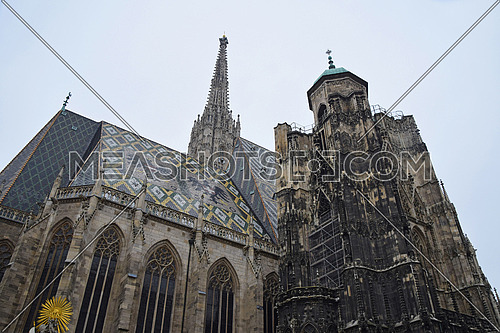 St Stephen Cathedral (Stephansdom) at Stephansplatz, the biggest cathedral and most important religious building in Vienna, Austria, low angle side view