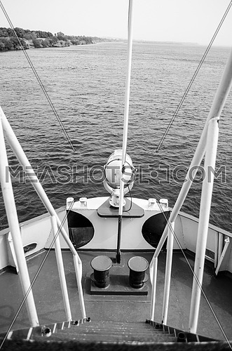 A front deck of a boat in black and white
