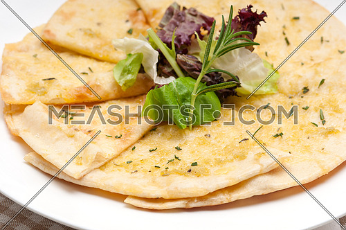fresh healthy garlic pita bread pizza with salad on top