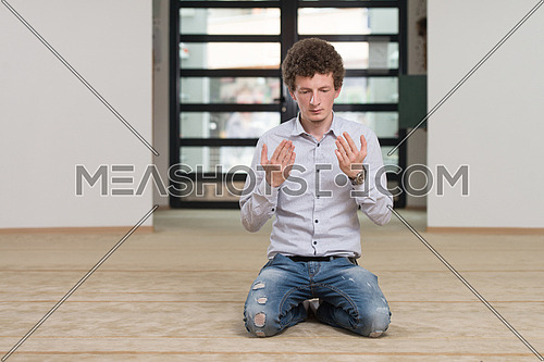 White Muslim Man Is Praying In The Mosque - Afro Lock Hair Curly