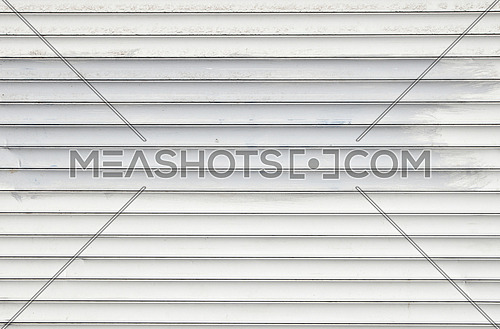 White dirty horizontal metal window roller shutter blinds background with gray paint strokes