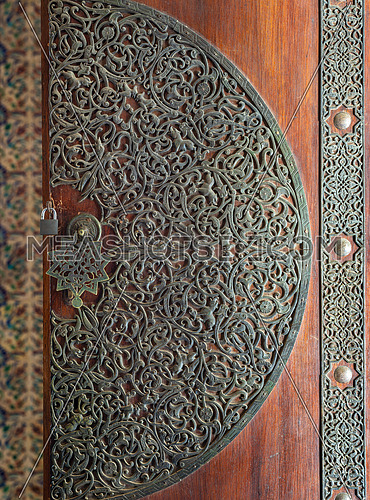 Wooden decorated copper plated door from the royal era, Manial palace of Prince Mohamed Ali, Cairo, Egypt