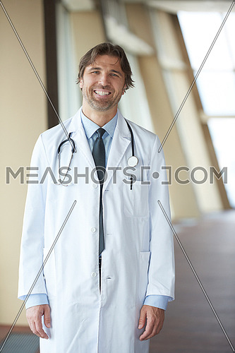 handsome doctor portrait  at modern hospital clinic indoors