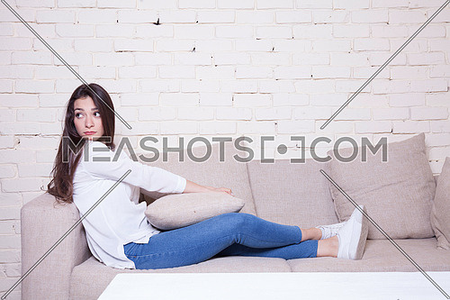 A girl sitting on couch