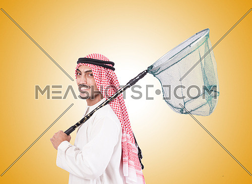 Arab businessman with catching net against gradient 