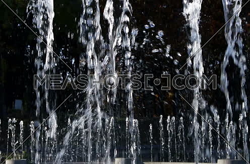 Fountain Splashing Water With Black Background