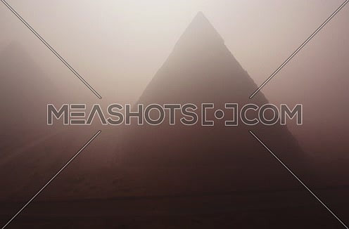 Aerial Foggy Shot for the Pyramids at Giza at Day