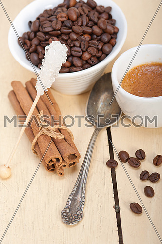 espresso coffee  over white wood rustic table  with sugar and spice