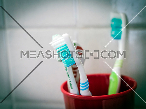 Several toothbrushes in a bathroom