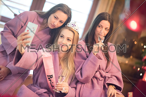 group of female friends in spa have fun, celebrate bachelorette party