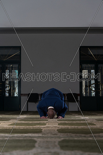 Businessman Muslim Making Traditional Prayer To God Allah In The Mosque