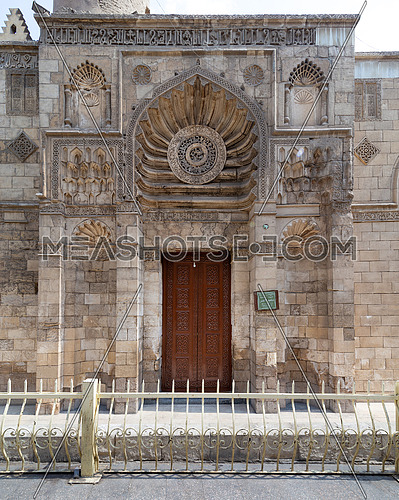 Entrance of Fatimid era historical public Aqmar Mosque, also, Moonlit mosque, with lavish decoration across the entire facade, Muizz Street, Gamalia District, Cairo, Egypt