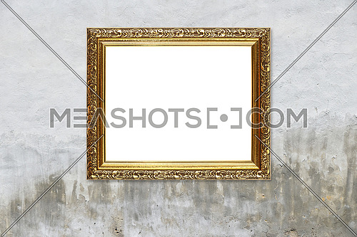 Close up antique old baroque ornate wooden classic golden painted horizontal rectangular frame for picture or photo, over grey concrete and plaster wall background