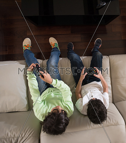 middle eastern children happily play video games and enjoy it with a smile on his face