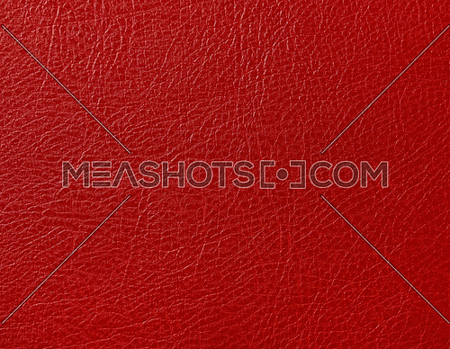 Close up background texture pattern of scarlet red natural leather grain, directly above