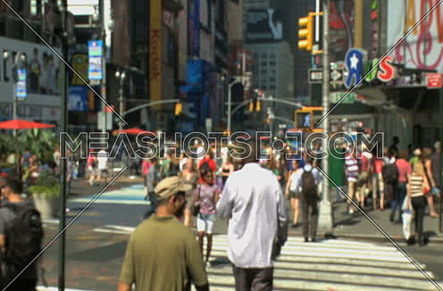 Long shot for Pedestrians walking through Times Square at day.