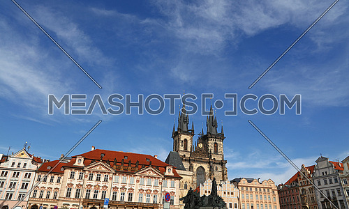 Low angle view of historical center of Old Town Square and Cathedral of Our Lady before Tyn over clear blue sky, Prague, Czech Republic