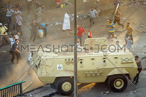 protesters attack armored forces of the armed forces in front of the Ministry of Finance of egypt on the day of the dismantling Rabaa al-Adawiya Square sit-in On 14 August 2013