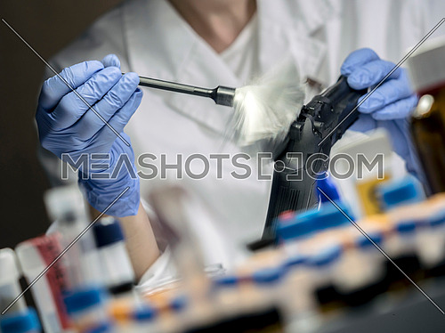 Expert Police takes samples in scientific laboratory, conceptual image