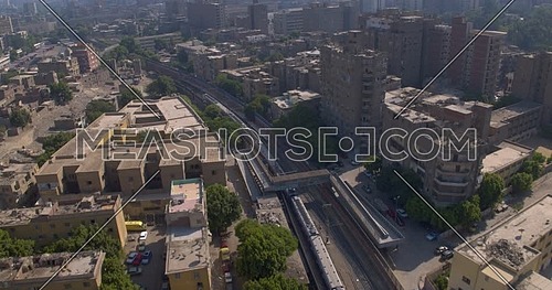 Follow shot for Metro then revealing the City of Cairo at day