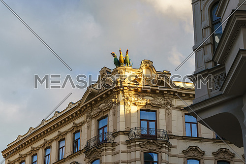 Beautiful facades of the historical building in Brno with "three gallos" .