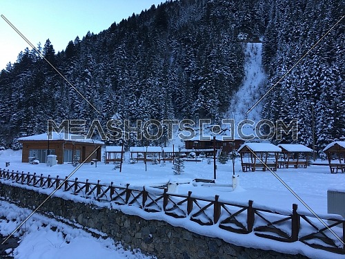 Long shot for Uzungöl (Long Lake) covered with snow - Trabzon, Turkey in the winter by the day.