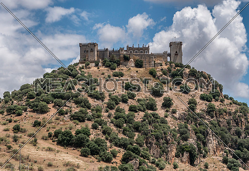 Almodovar del Rio, CÃ³rdoba, Spain - June 9, 2018: It is a fortitude of Moslem origin, it was a Roman fort and the current building has definitely origin Berber, of the year 760, Between the year 1901 and 1936 was restored by its owner, Rafael Desmaissieres y Farina, XII Count of Torralva, placed close to the Guadalquivir, take in Almodovar of the Rio, Cordoba province, Andalusia, Spain