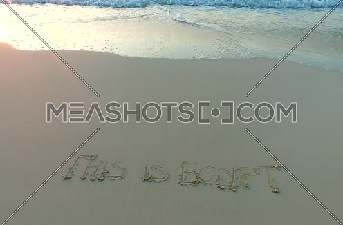 Track Shot for (This is egypt) written on the sand at sunset