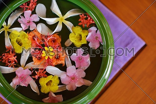 water cup with beautiful flowers, a variety of background colors in spa health and beauty center
