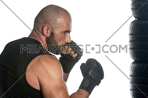 Muscular Sports Guy Boxing Workout Over White Background Isolated - Boxer Is Hitting A Rubber