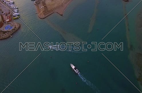 Drone shot flying above A yacht going to AL Gouna Marina at Day 
