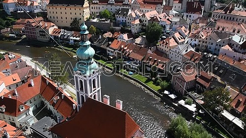 High angle aerial summer day view historical old town of Cesky Krumlow with cathedral tower over Vltava river, Czech Republic