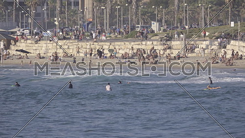 View of crowded beach near the coastal city Tel Aviv