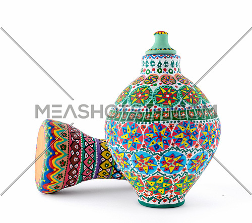 Two pieces of colorful painted potteries, an Egyptian drinking jar (arabic: Kolla) and a goblet drum (also chalice drum, tarabuka, darbuka, debuka)