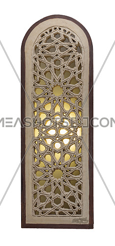 Perforated arched stucco window decorated with stain glass with geometrical patterns, one of the traditions of the Mamluk era, isolated on white
