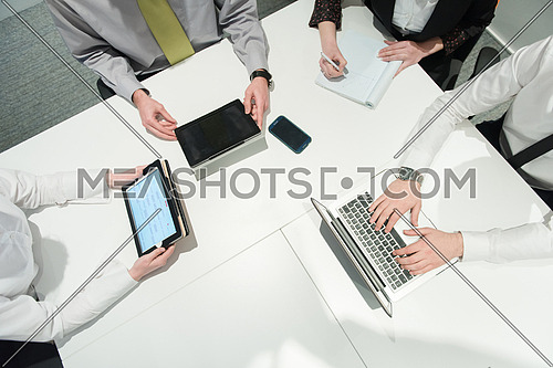 aerial top view  of business people group brainstorming on meeting and businessman presenting ideas and projects on laptop and tablet computer